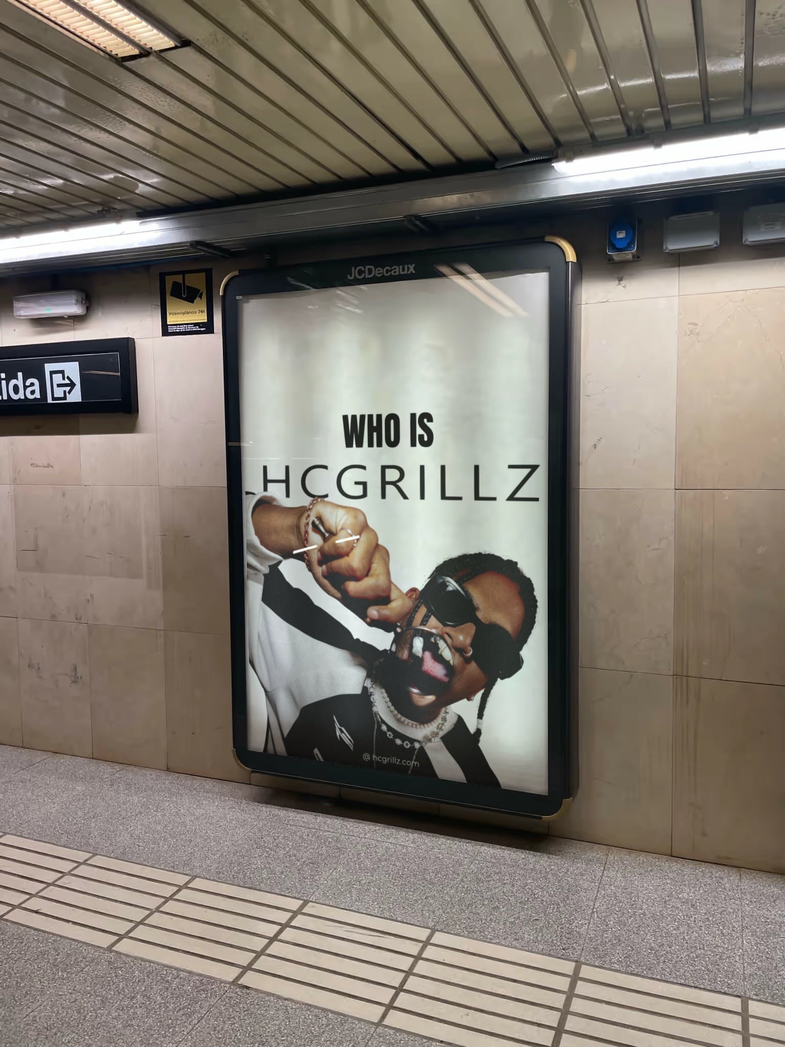 Guy wearing grillz on billboard